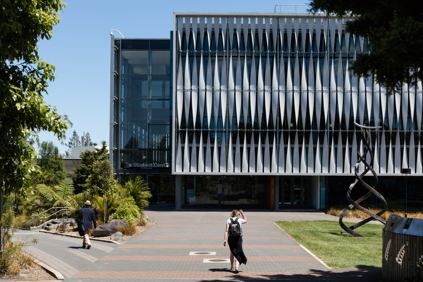student-walking-towards-library-entrance