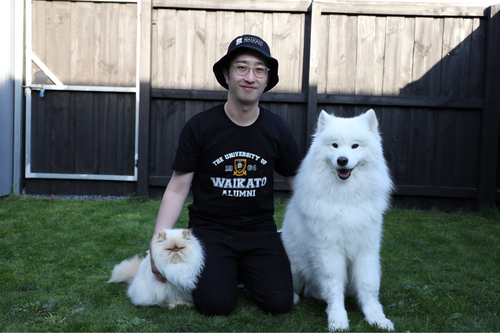 Alumnus Wei Cheng Phee with his dog and cat.