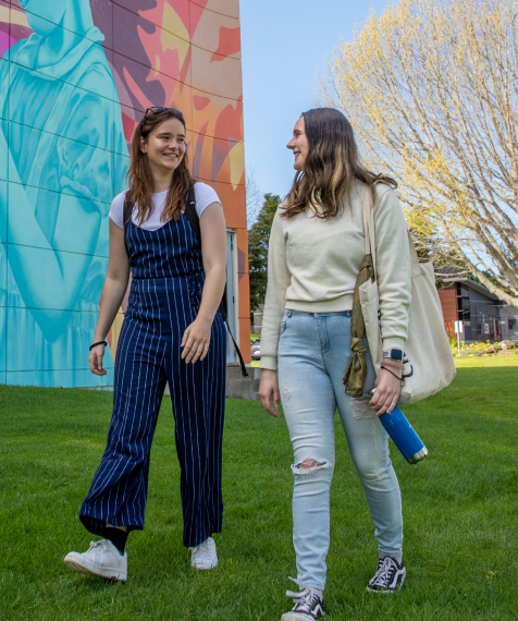two students walking past gapa mobile