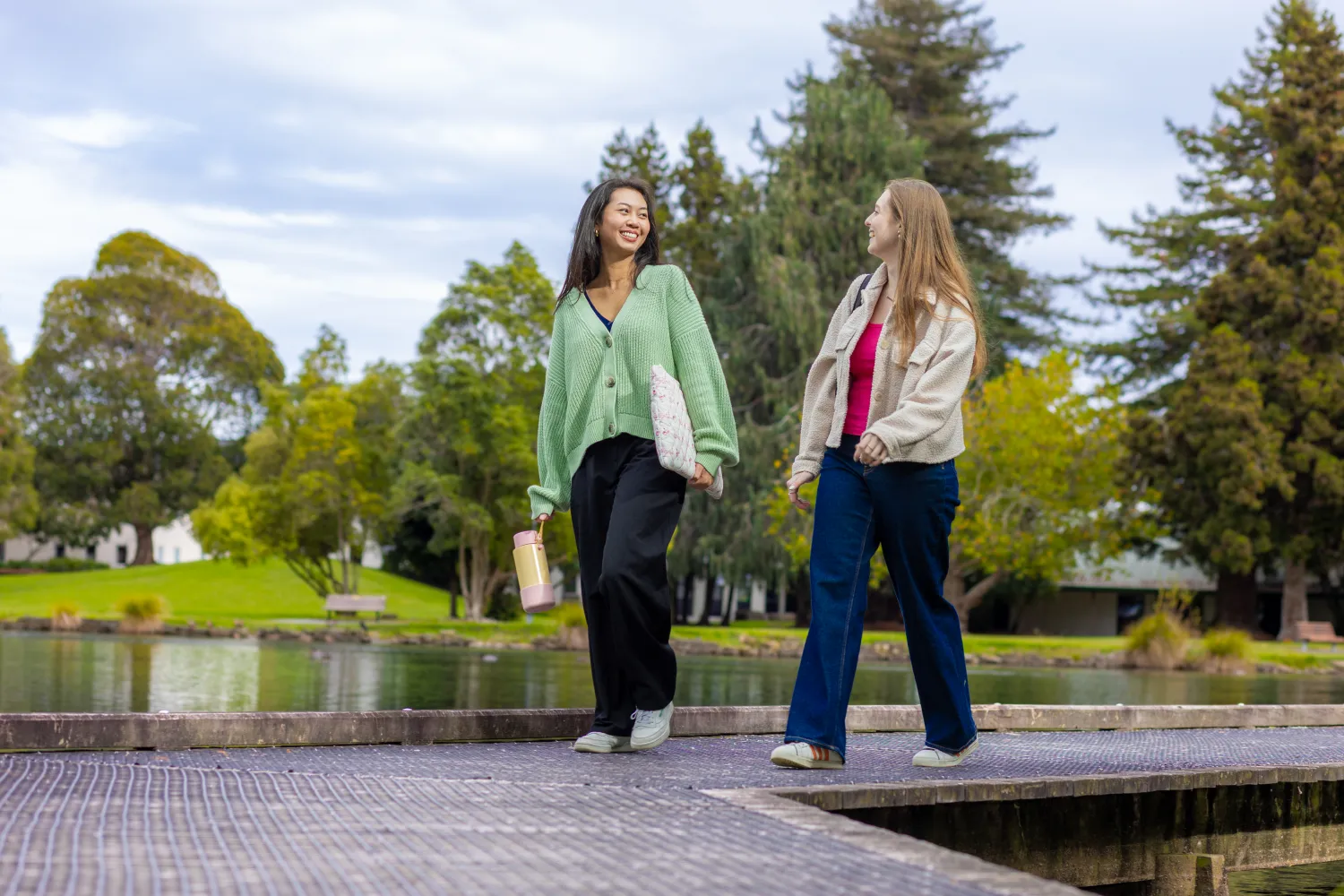 students walking on lake boardwalk