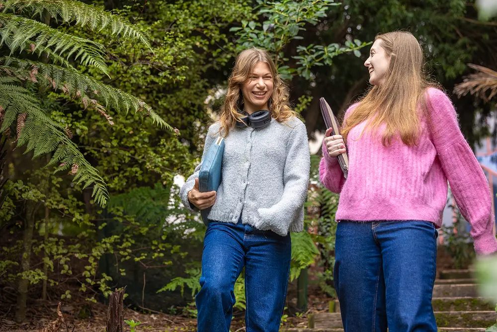 students walking through forest