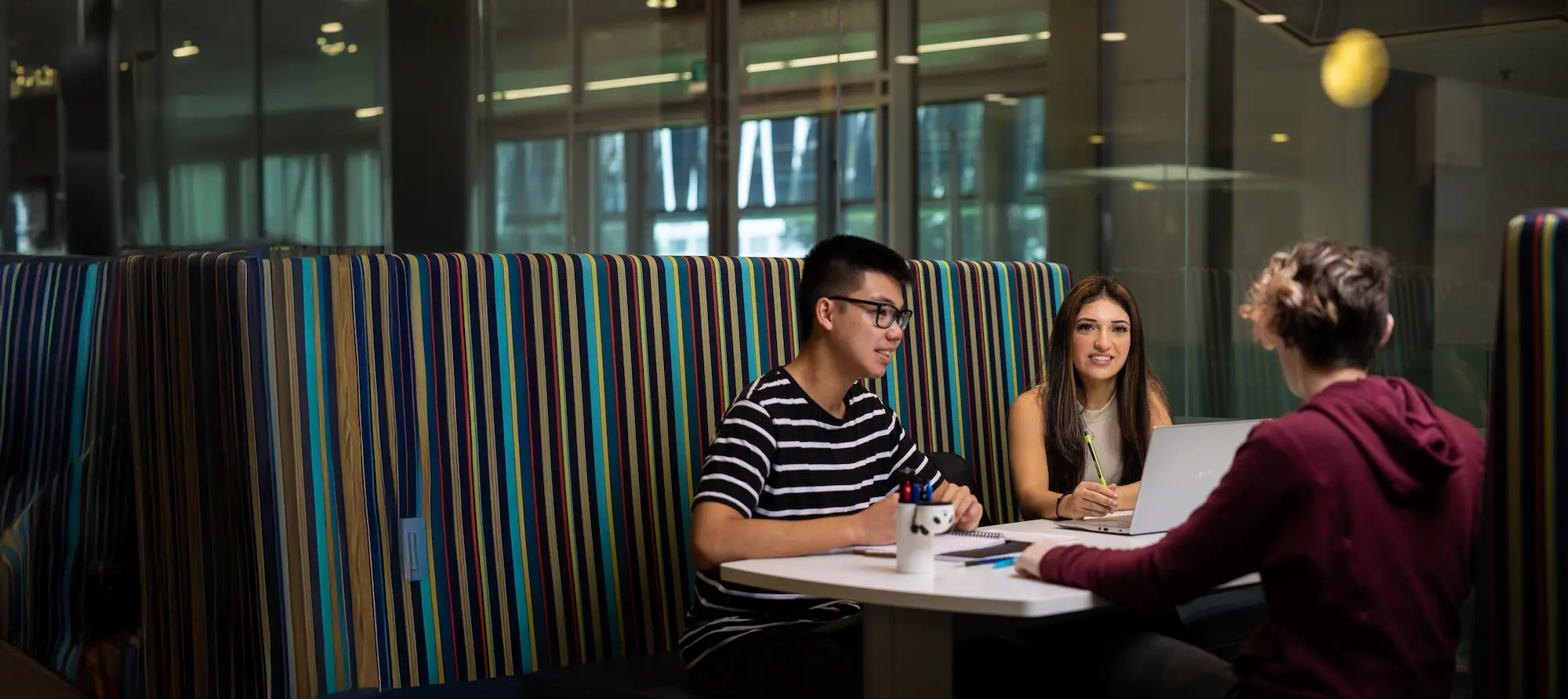 unistart student sitting in library