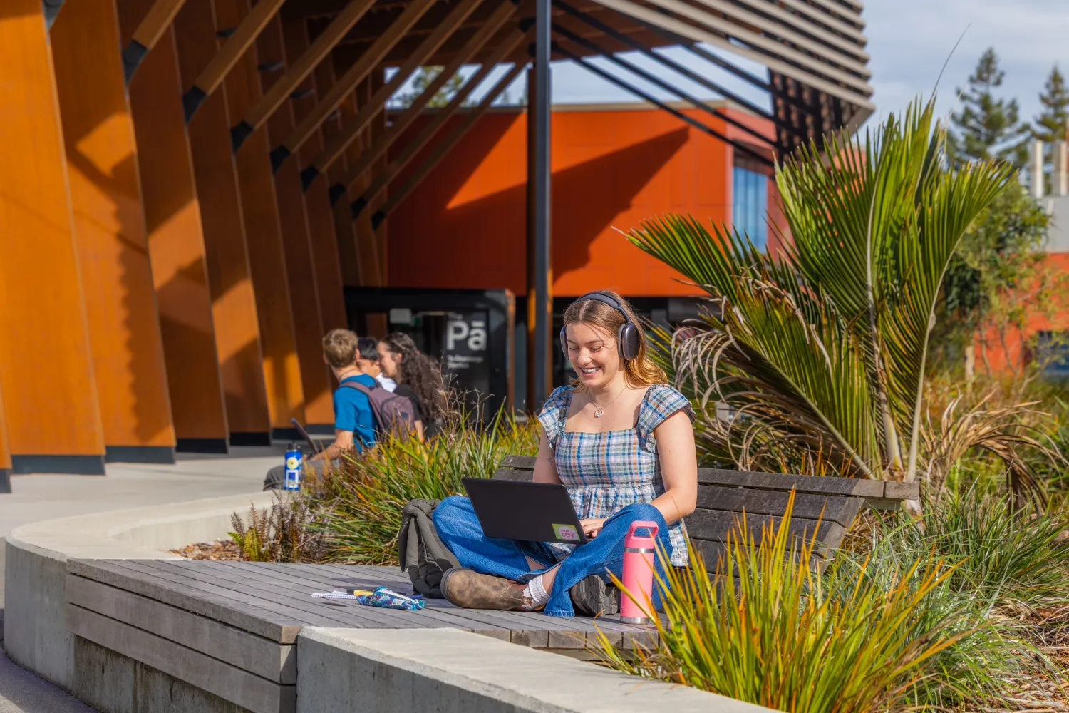 student-sitting-studying-outside-pa