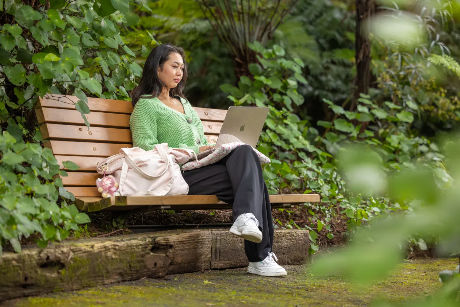 student-studying-on-bench