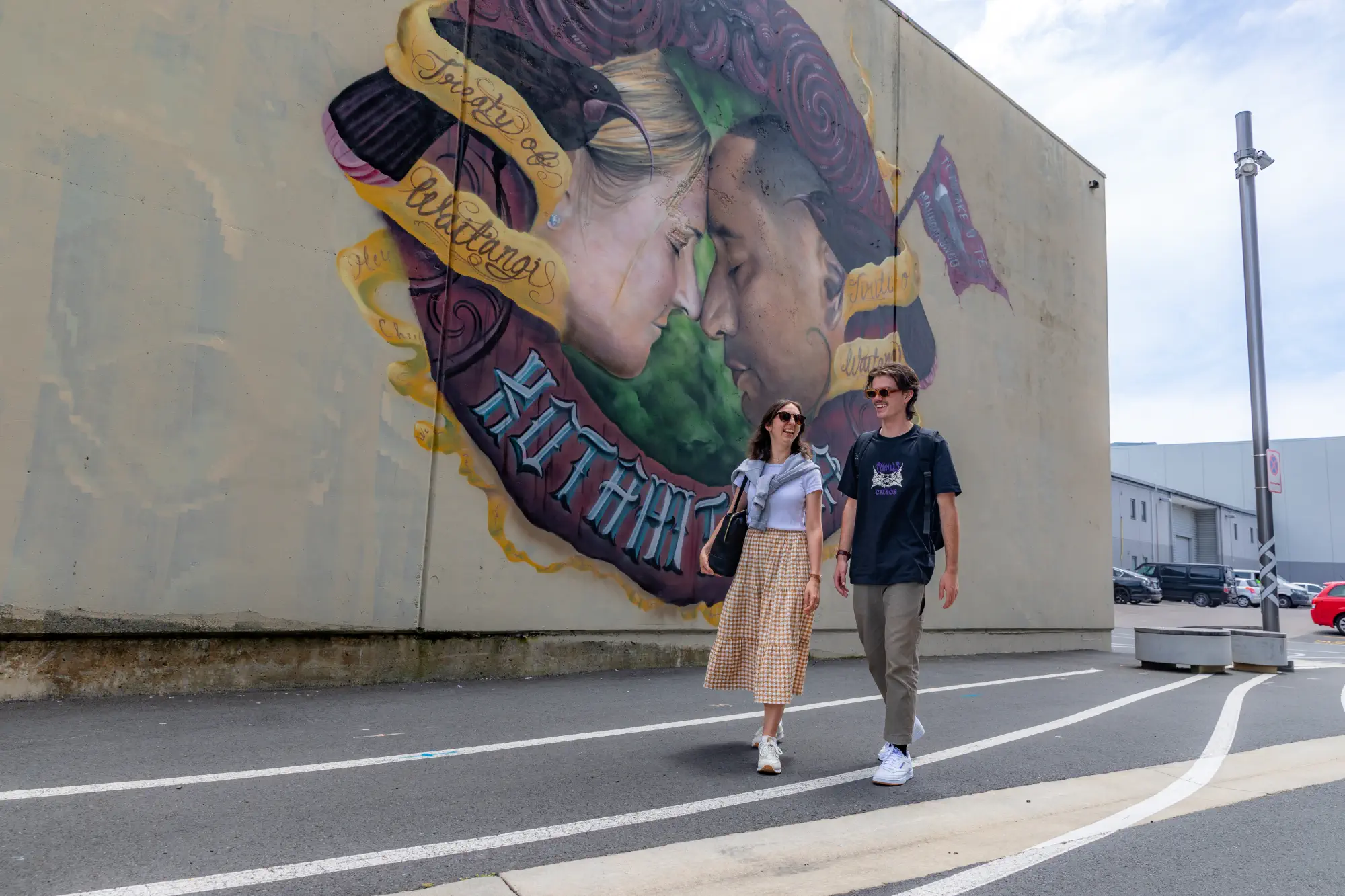 two-students-walking-on-sunny-street