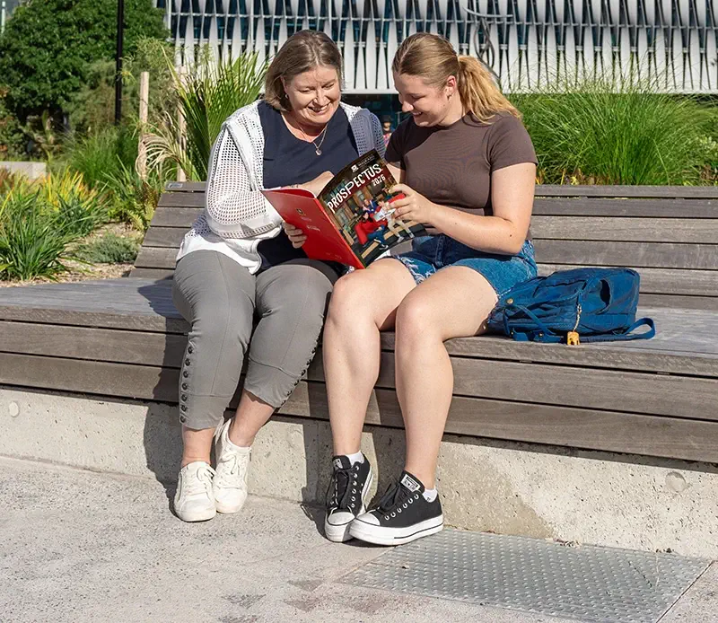 parent-and-student-looking-at-prospectus-mobile